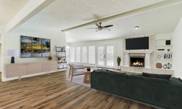 2708 Raintree Drive Plano, TX 75074 - Photo 1 of 1 a living room with furniture wooden floor and a fireplace