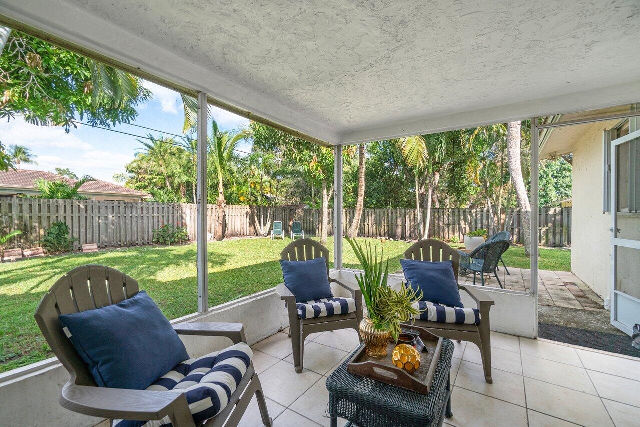1069 West Camino Real Boca Raton, FL 33486 - Photo 17 of 21 a outdoor living space with furniture and garden view