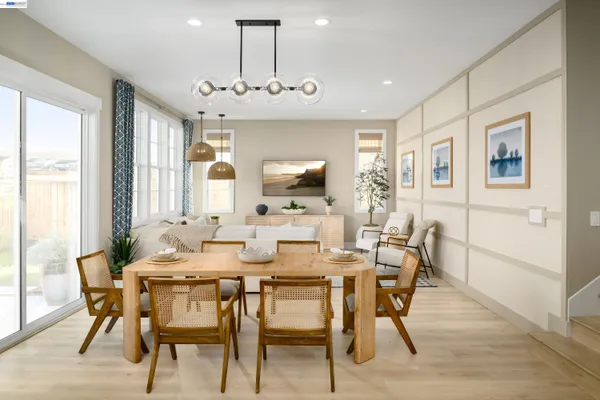 a view of a dining room with furniture window and wooden floor