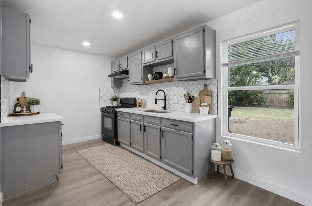 3013 Bloomfield Street Houston, TX 77051 - Photo 4 of 10 a kitchen with a sink cabinets and window