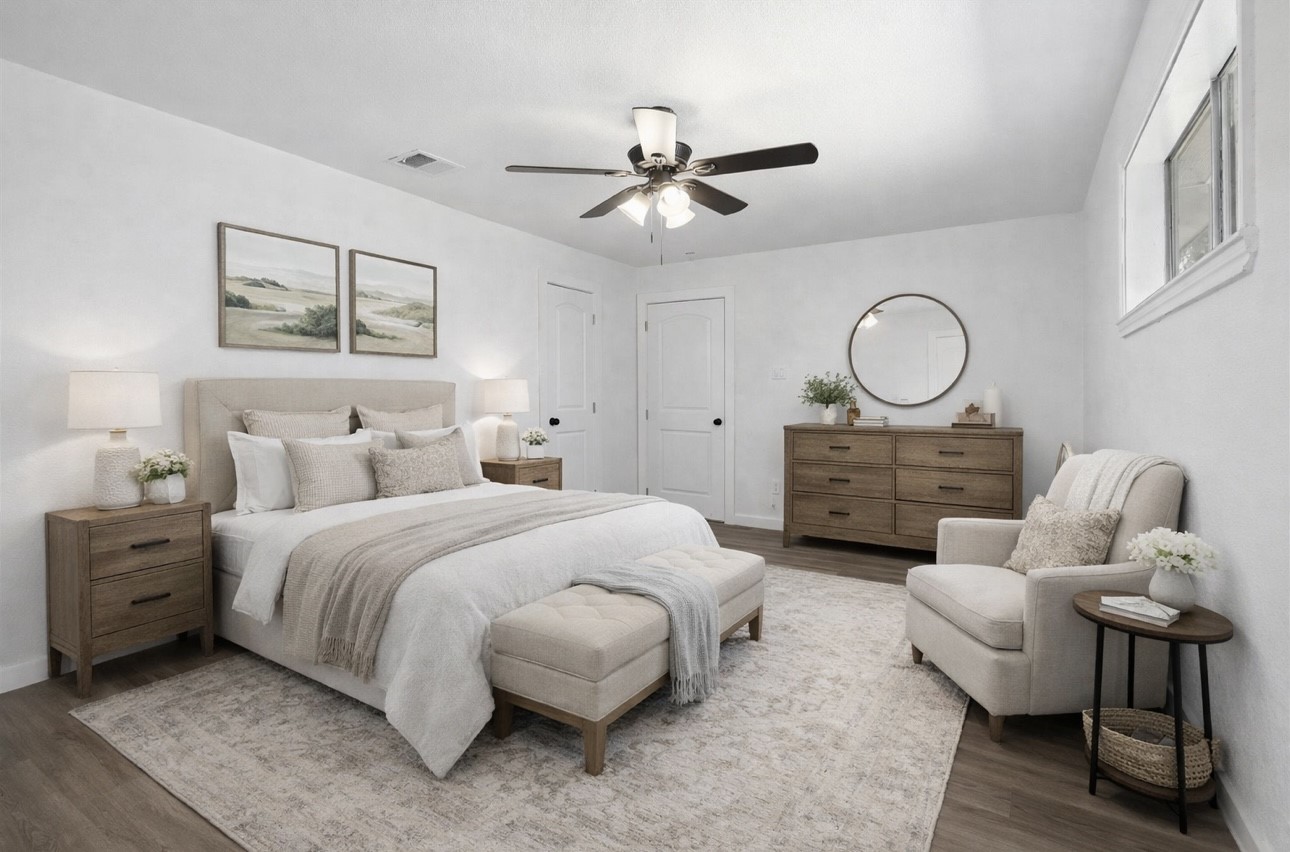 3013 Bloomfield Street Houston, TX 77051 - Photo 5 of 10 a spacious bedroom with a bed a couch and a chandelier