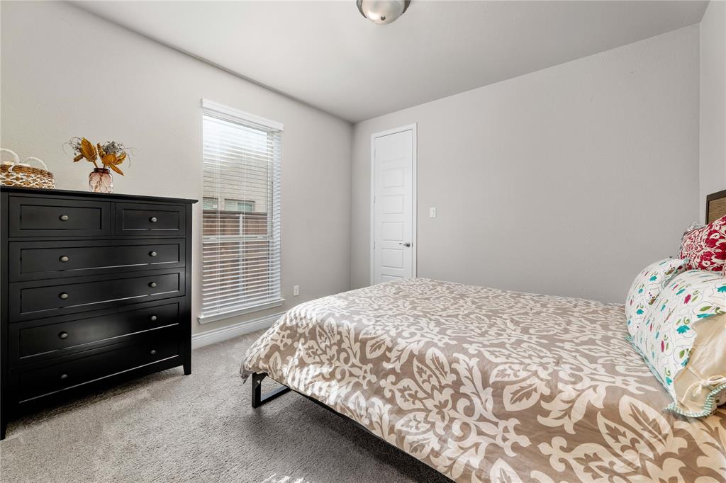 16541 Sweetgum Road Frisco, TX 75033 - Photo 14 of 28 a bedroom with a bed and a window