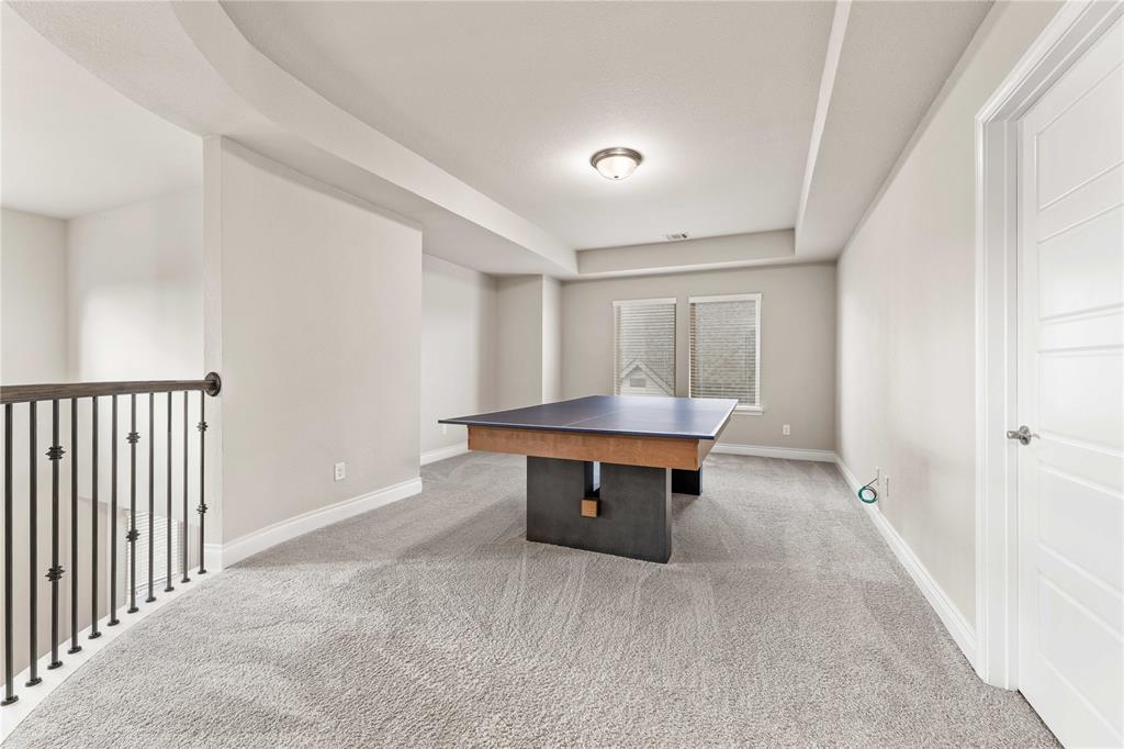 16541 Sweetgum Road Frisco, TX 75033 - Photo 19 of 28 Playroom featuring light colored carpet and a raised ceiling