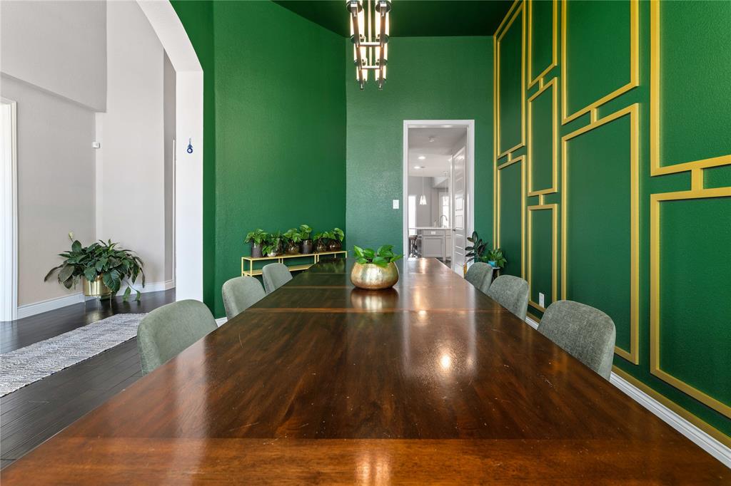 16541 Sweetgum Road Frisco, TX 75033 - Photo 4 of 28 Dining space with dark wood-type flooring, suspended lighting, and a high ceiling