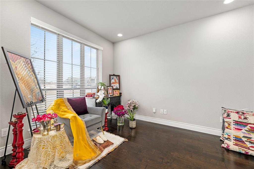 16541 Sweetgum Road Frisco, TX 75033 - Photo 9 of 28 a living room with furniture and a floor to ceiling window