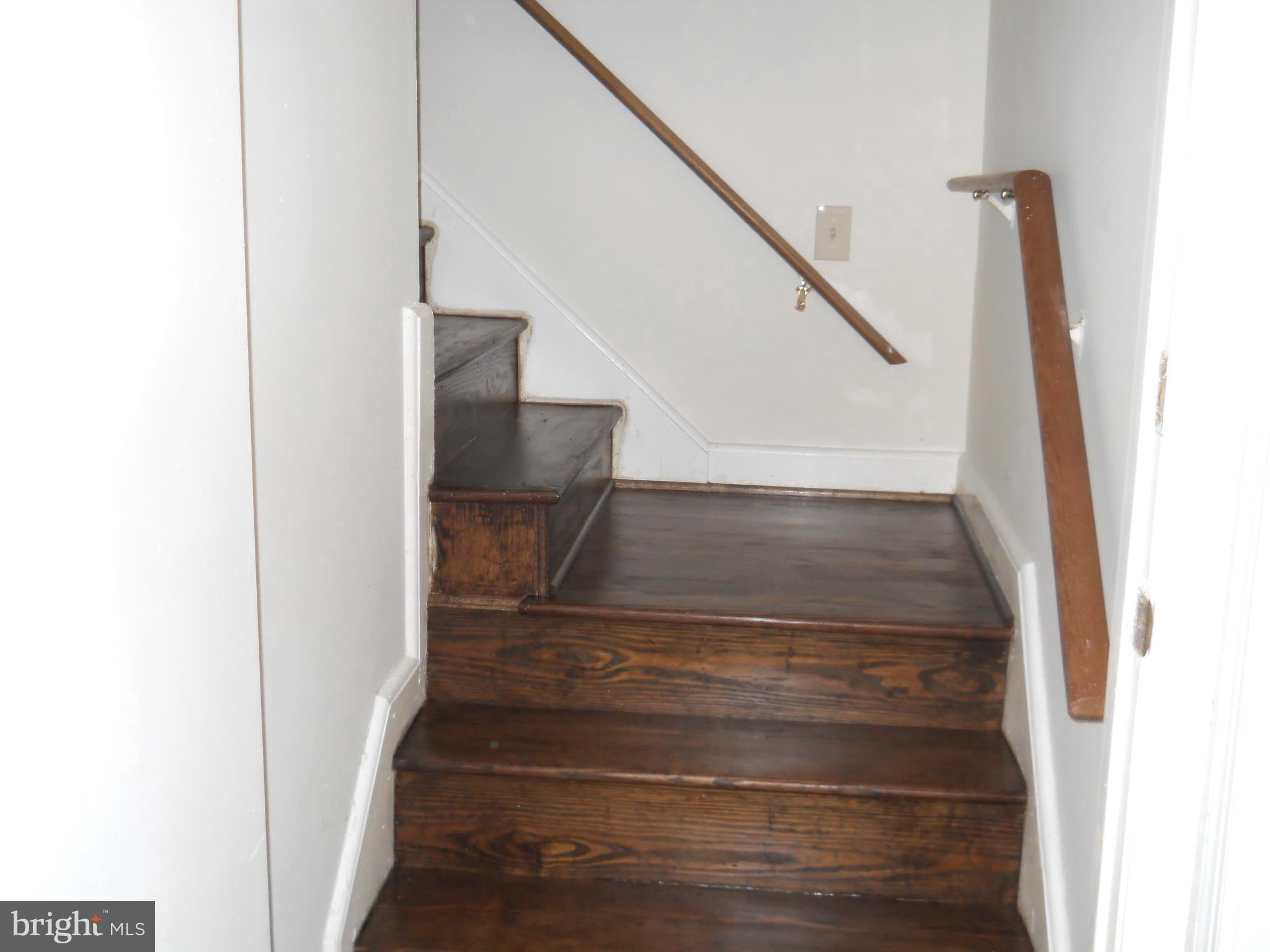 12323 Judson Road Silver Spring, MD 20906 - Photo 14 of 52 HARDWOOD STAIRCASE TO UPPER LEVEL