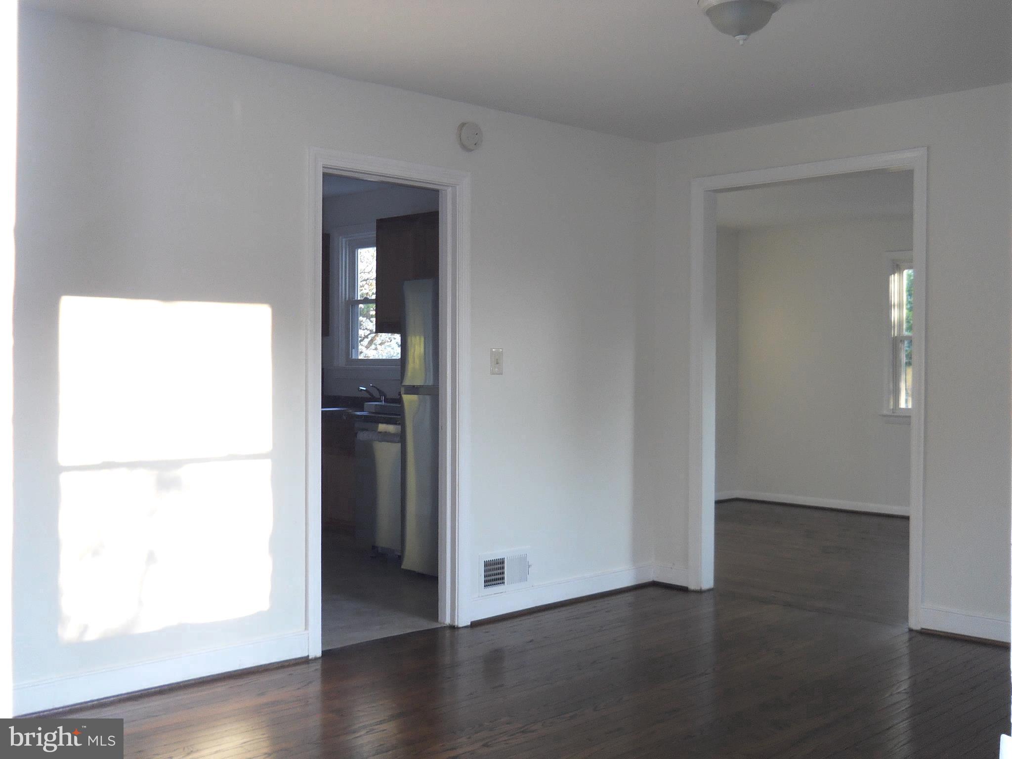 12323 Judson Road Silver Spring, MD 20906 - Photo 10 of 52 LIVING ROOM, FAMILY ROOM & KITCHEN ENTRANCE