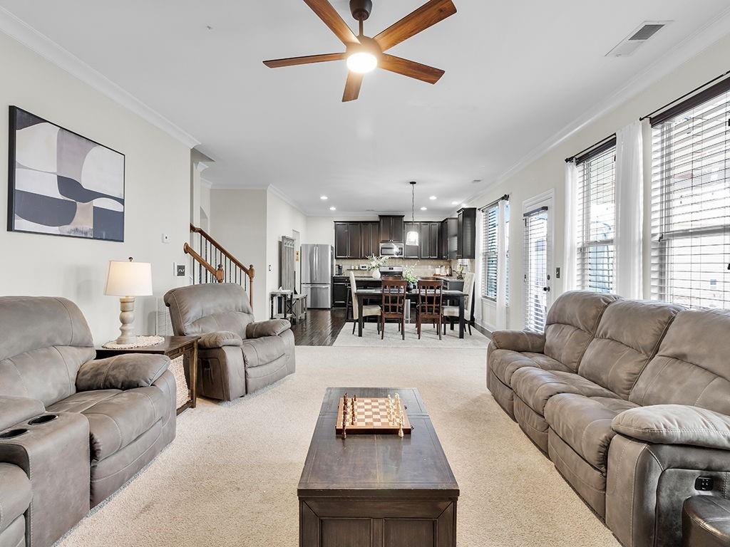 5110 Rialto Way Cumming, GA 30040 - Photo 18 of 50 a living room with furniture kitchen view and a large window