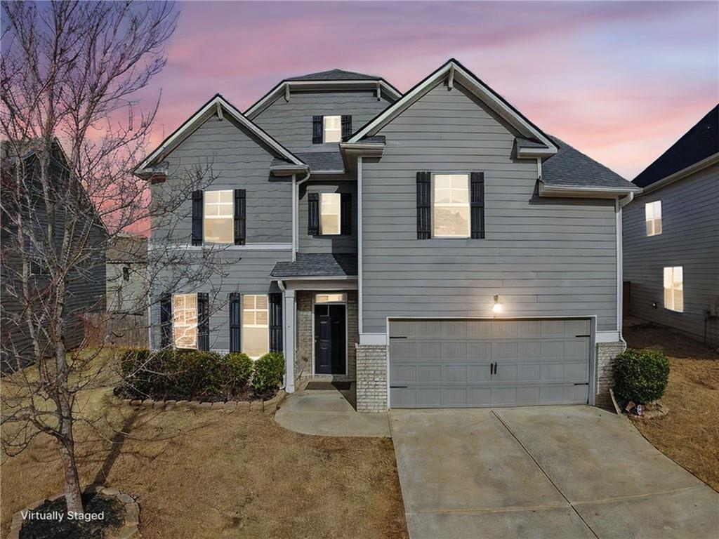 5110 Rialto Way Cumming, GA 30040 - Photo 2 of 50 a front view of a house with garage