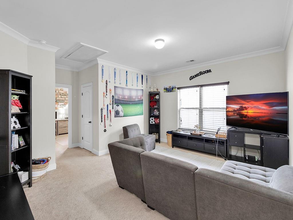 5110 Rialto Way Cumming, GA 30040 - Photo 24 of 50 a living room with furniture and a flat screen tv