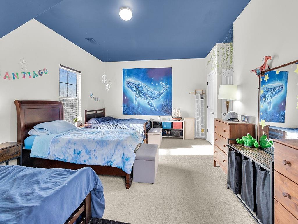 5110 Rialto Way Cumming, GA 30040 - Photo 27 of 50 a bedroom with a bed and a chandelier