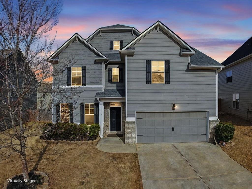 5110 Rialto Way Cumming, GA 30040 - Photo 3 of 50 a front view of a house with a yard