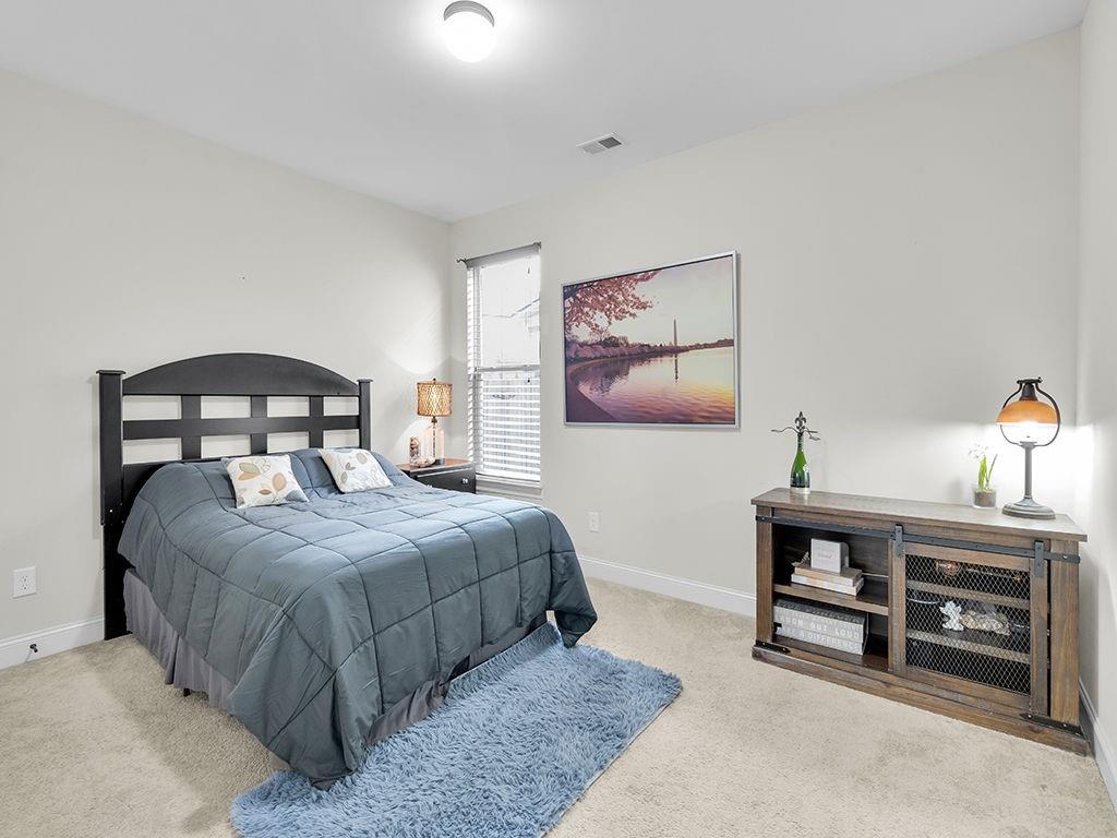 5110 Rialto Way Cumming, GA 30040 - Photo 33 of 50 a bedroom with a bed and a desk