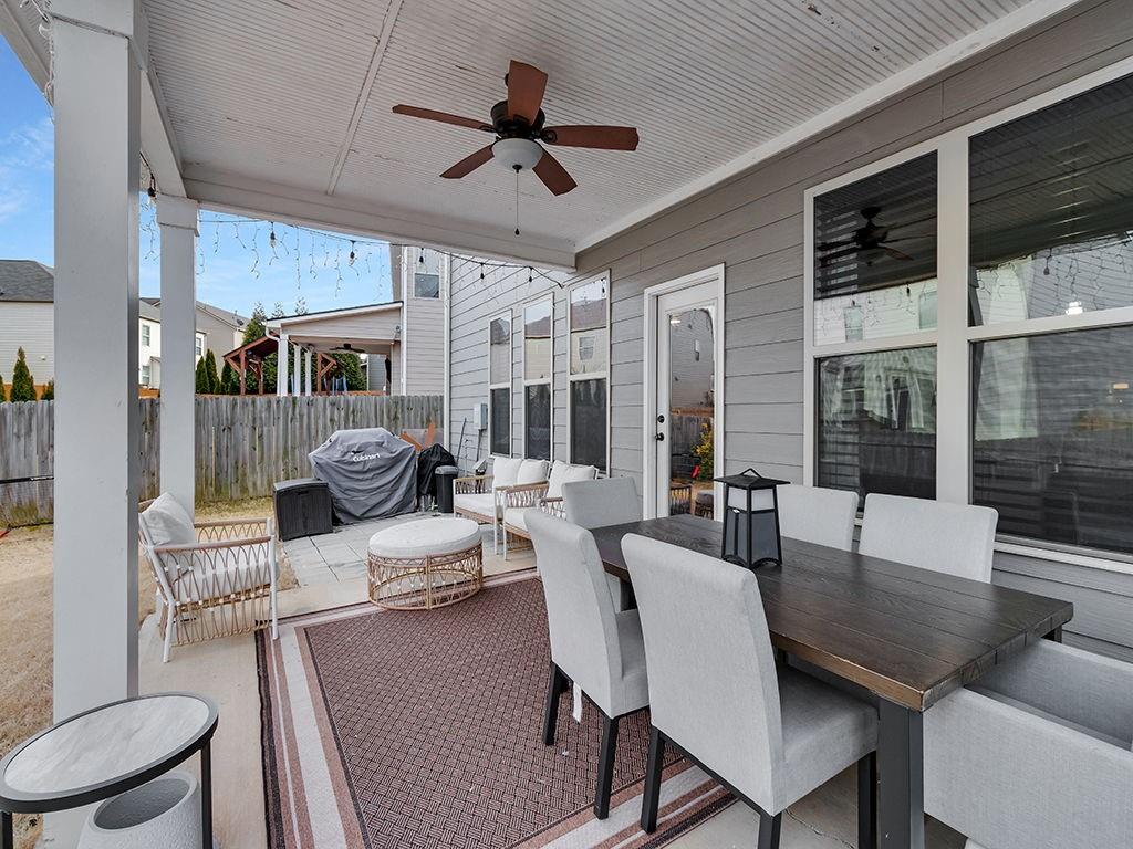 5110 Rialto Way Cumming, GA 30040 - Photo 37 of 50 a living room with furniture and a large window