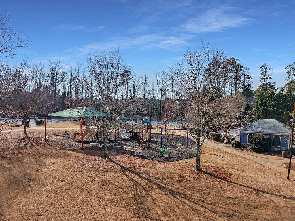 5110 Rialto Way Cumming, GA 30040 - Photo 40 of 50 a view of a swimming pool with a yard