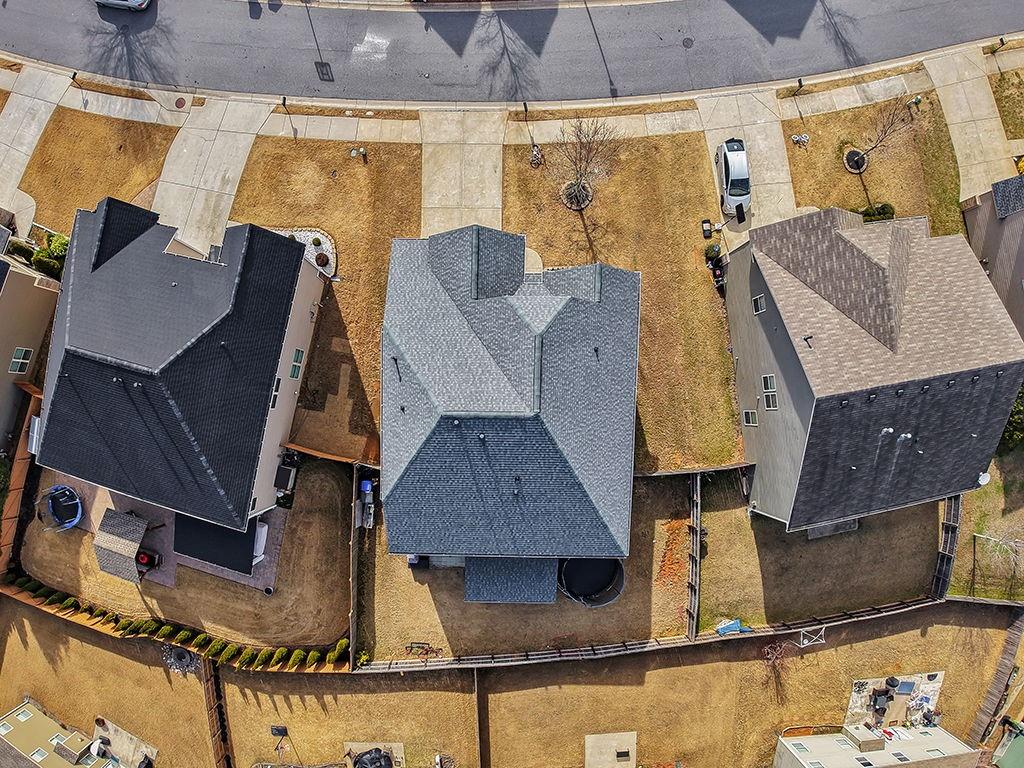 5110 Rialto Way Cumming, GA 30040 - Photo 43 of 50 an aerial view of a house with a swimming pool