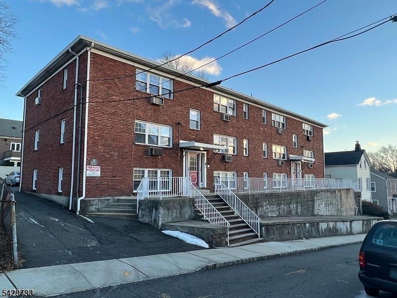 26 Clinton Street, Unit 9 Belleville, NJ 07109 - Photo 1 of 6 a front view of a house with a yard
