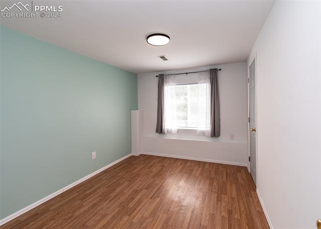 995 Winebrook Way Fountain, CO 80817 - Photo 39 of 44 Spare room with hardwood / wood-style floors