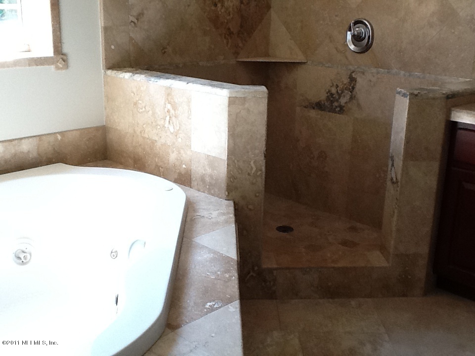 4130 Appaloosa Road Middleburg, FL 32068 - Photo 14 of 15 a bathroom with a shower