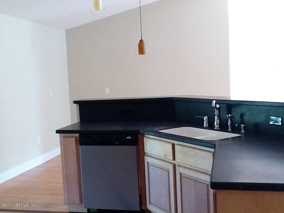 4130 Appaloosa Road Middleburg, FL 32068 - Photo 7 of 15 a kitchen with a sink and cabinets
