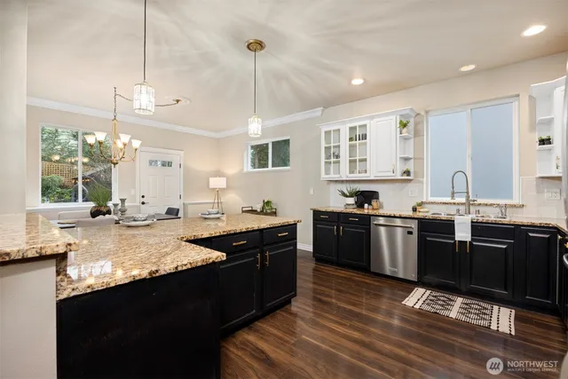 a large kitchen with lots of counter space and a sink