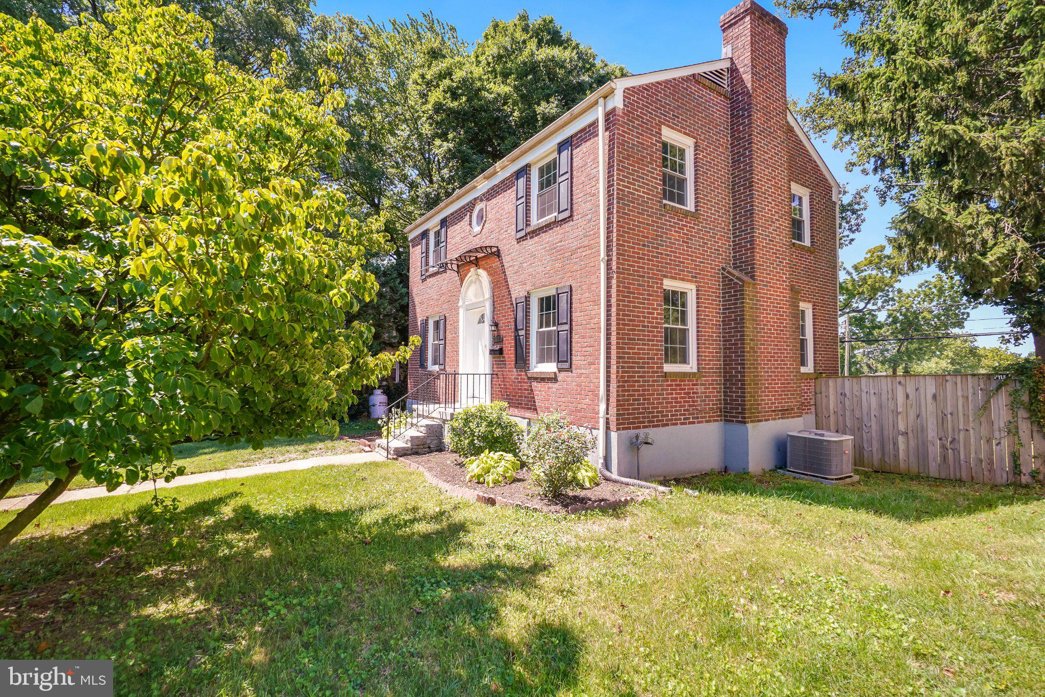 7022 Deerfield Road Pikesville, MD 21208 - Photo 3 of 30 Charming brick home in lush surroundings.