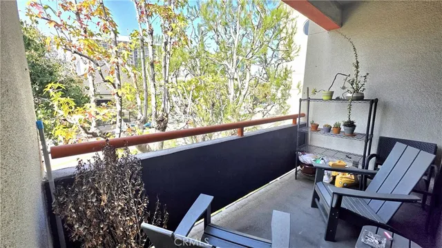 a view of balcony with furniture