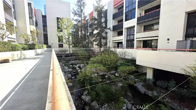 a view of a brick building next to a yard