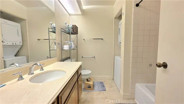a bathroom with a sink double vanity granite tub shower and mirror