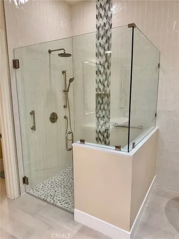 a bathroom with a shower and a sink