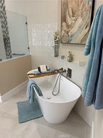 a white bath tub sitting in a bathroom