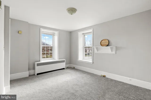 a view of room with closet and window