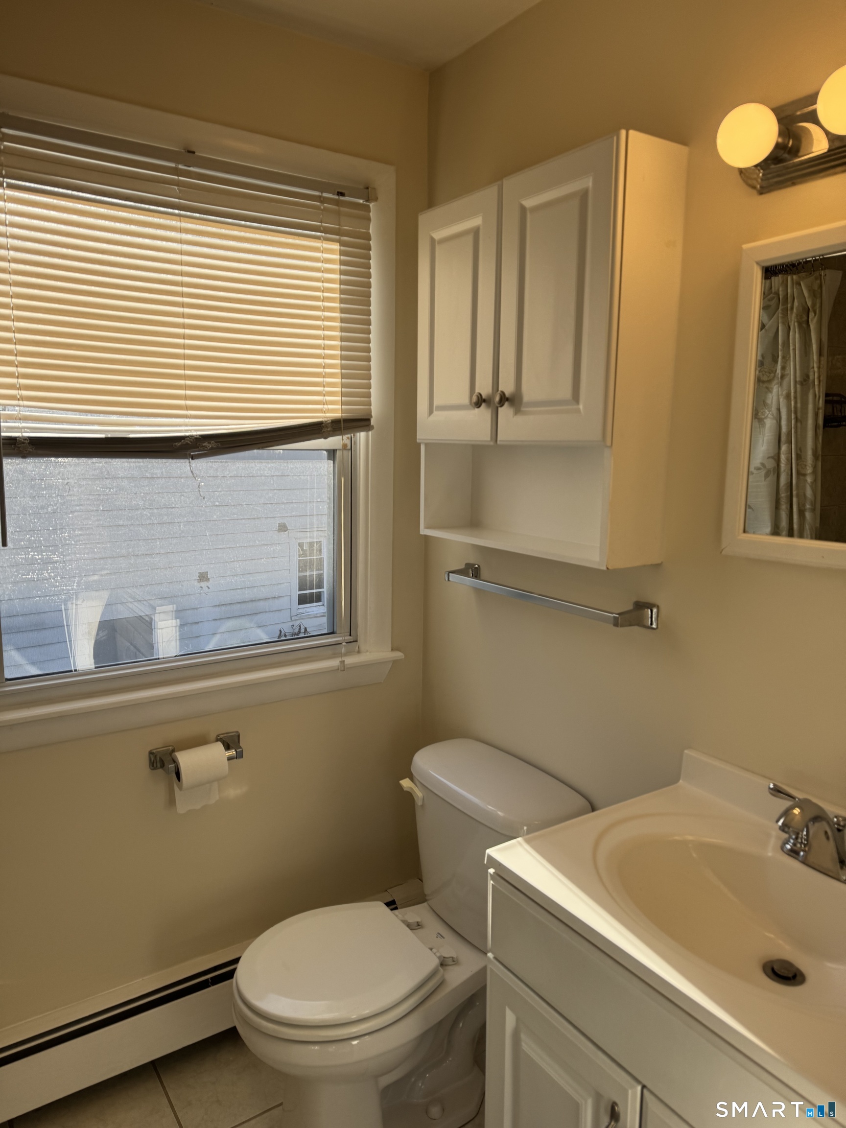 855 Black Rock Turnpike, Unit 1 Fairfield, CT 06825 - Photo 12 of 17 a bathroom with a sink a toilet and bathtub