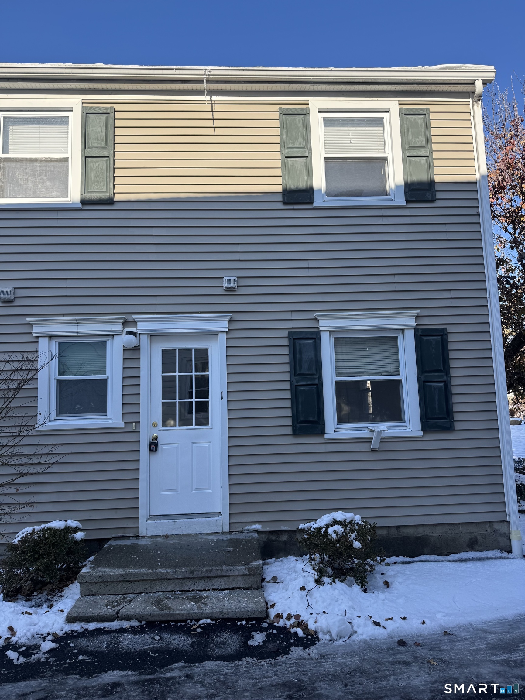 855 Black Rock Turnpike, Unit 1 Fairfield, CT 06825 - Photo 15 of 17 a view of a house with a yard