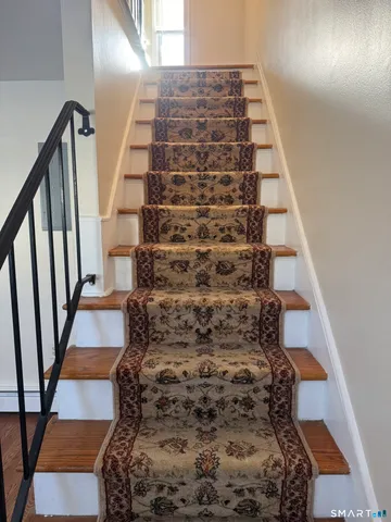 a view of entryway with wooden floor
