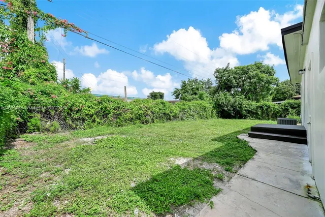 a view of a garden and basketball court