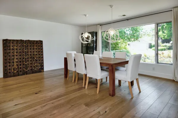 a dining room with furniture window wooden floor