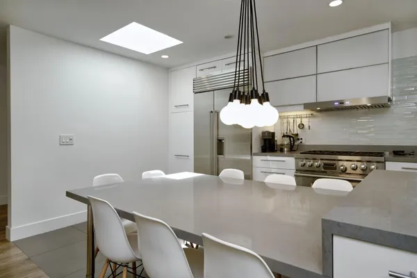 a kitchen with a table and chairs