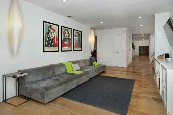 a living room with furniture and a rug