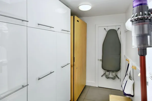 a view of room that has baby shelf and a shelf with wooden floor