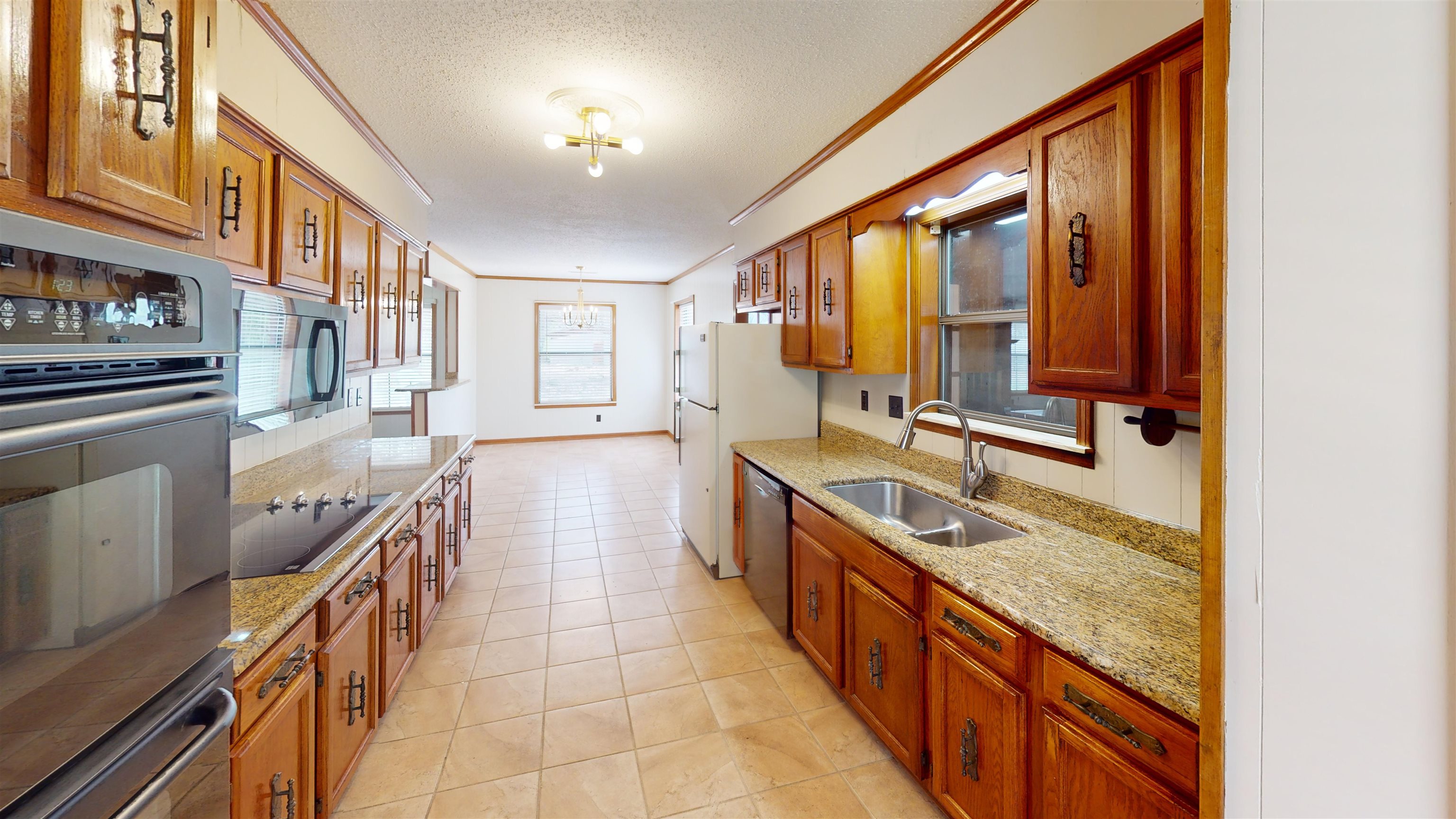 4800 Highway 196 Piperton, TN 38017 - Photo 12 of 37 a large kitchen with stainless steel appliances granite countertop a large stove a sink and a refrigerator