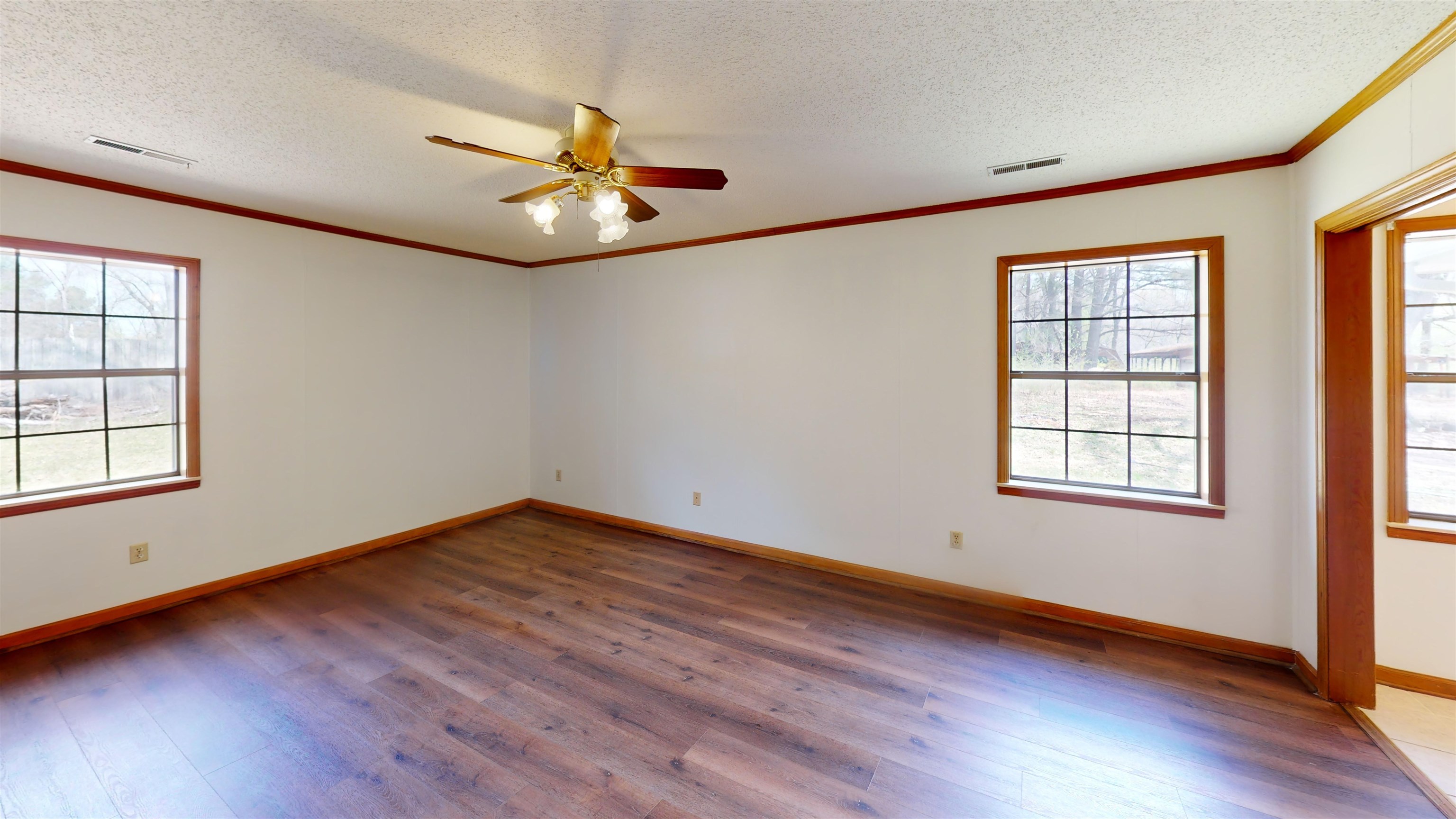 4800 Highway 196 Piperton, TN 38017 - Photo 23 of 37 a view of an empty room with wooden floor and a window