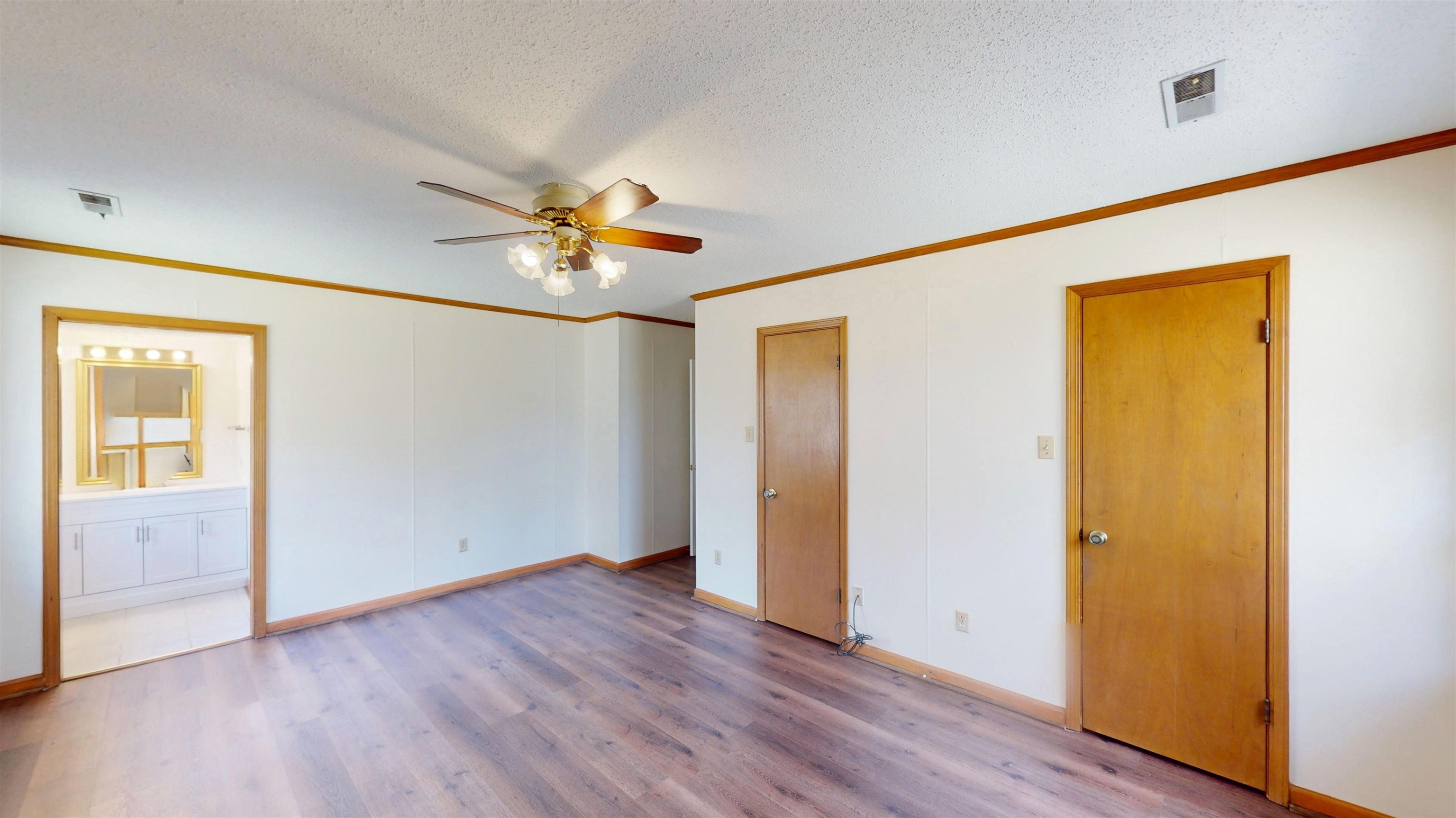 4800 Highway 196 Piperton, TN 38017 - Photo 24 of 37 an empty room with wooden floor and a ceiling fan