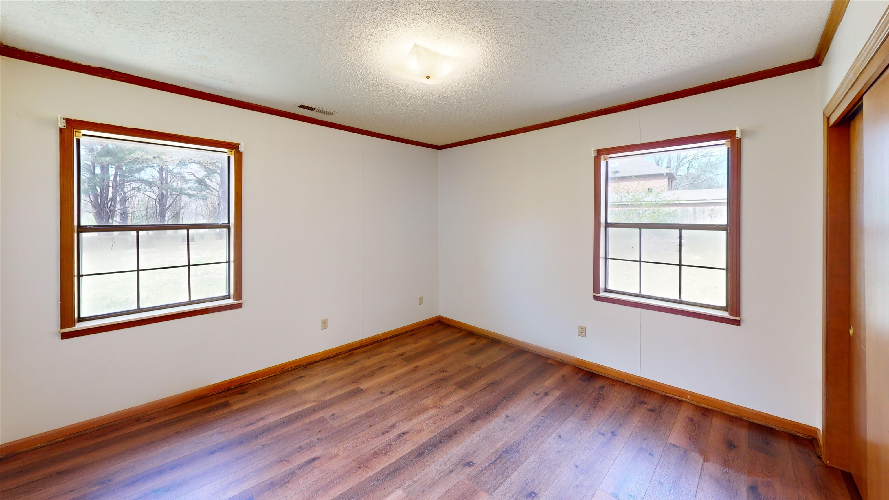 4800 Highway 196 Piperton, TN 38017 - Photo 34 of 37 a view of an empty room with wooden floor and a window