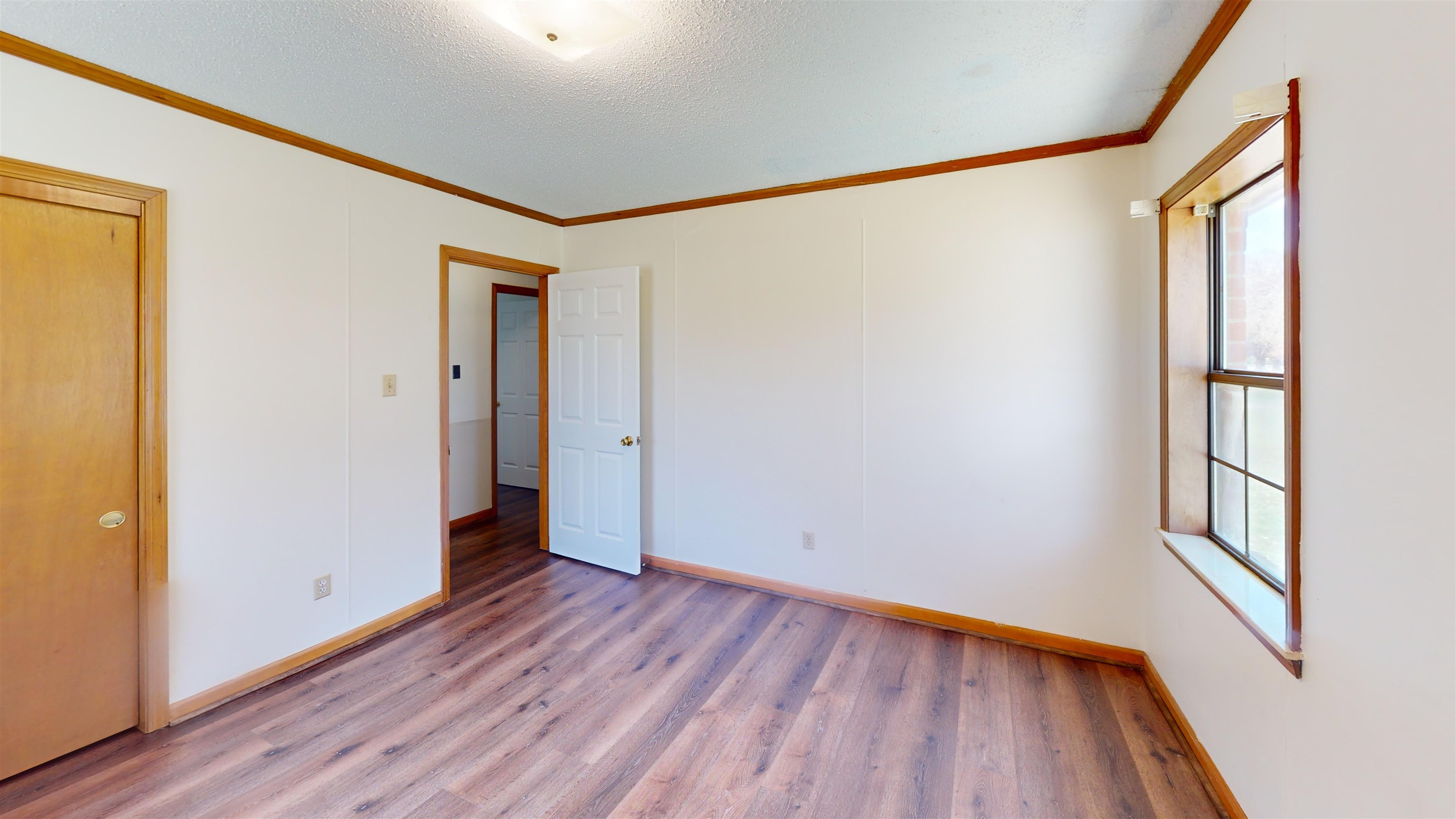 4800 Highway 196 Piperton, TN 38017 - Photo 35 of 37 a view of an empty room with wooden floor and a window