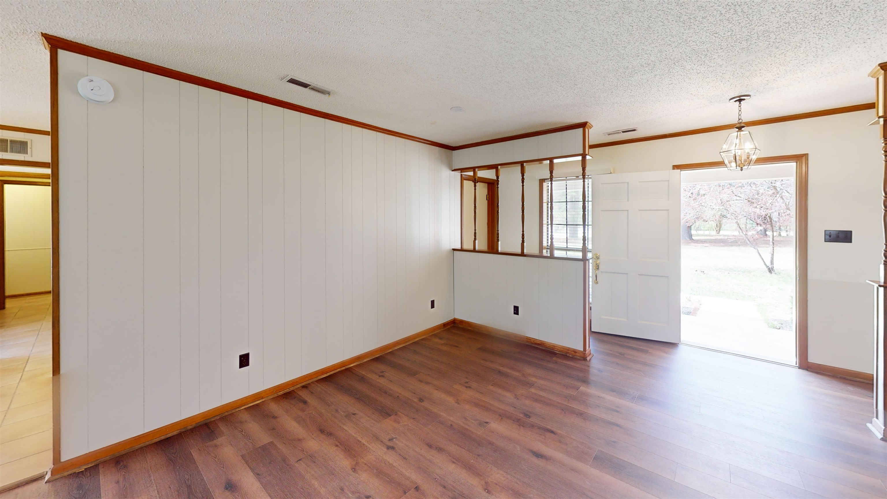 4800 Highway 196 Piperton, TN 38017 - Photo 7 of 37 a view of an empty room with wooden floor and a window