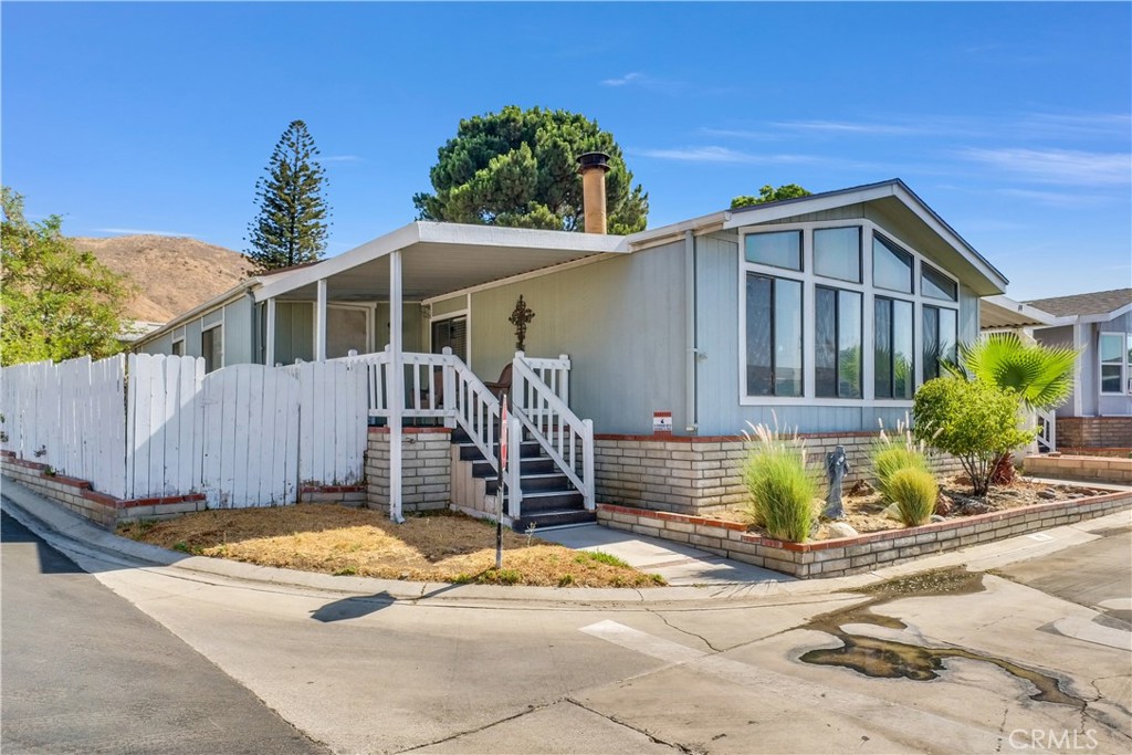 4080 Pedley Road, Unit 89 Jurupa Valley, CA 92509 - Photo 1 of 1 a front view of a house with a garage