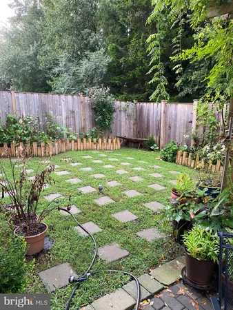a garden with trees in front of it