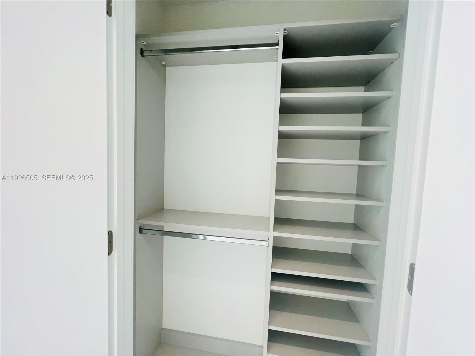 851 Northeast 1st Avenue, Unit 2808 Miami, FL 33132 - Photo 11 of 86 a view of walk in closet with empty racks