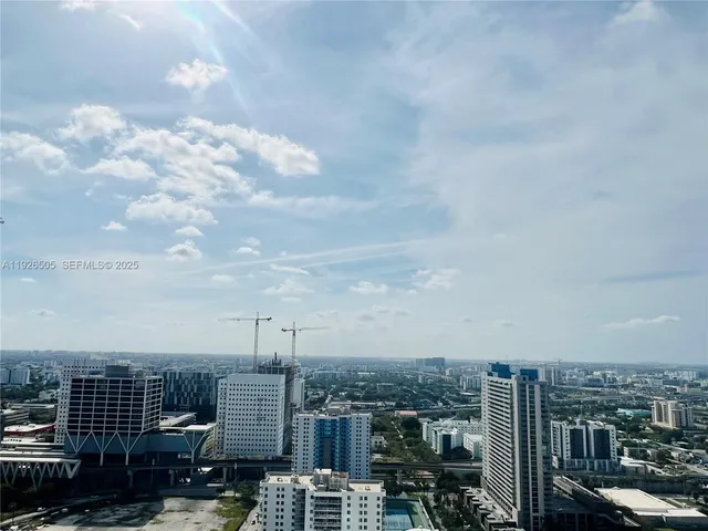 a view of an empty room with glass door